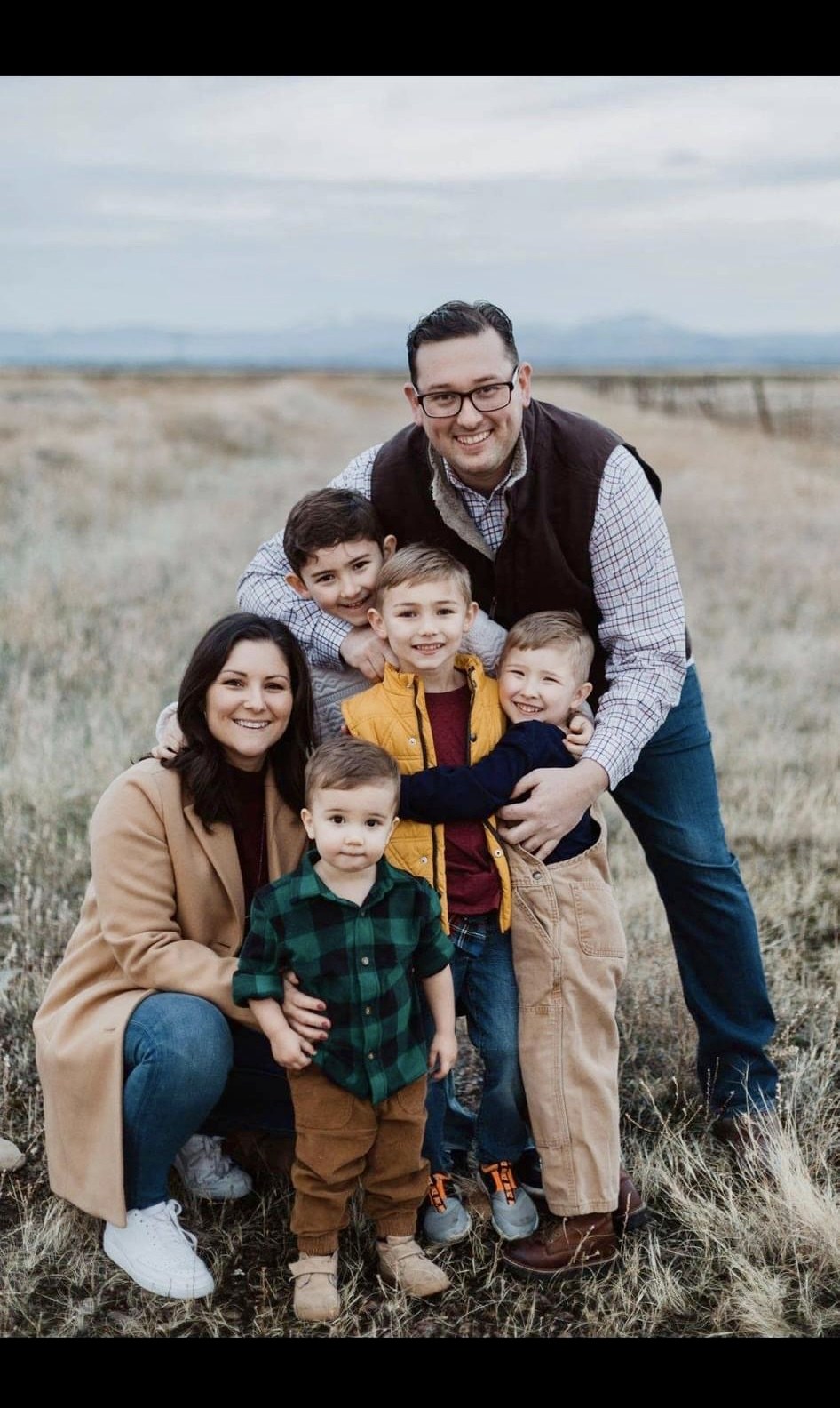 Jaime with her family in an autumn field